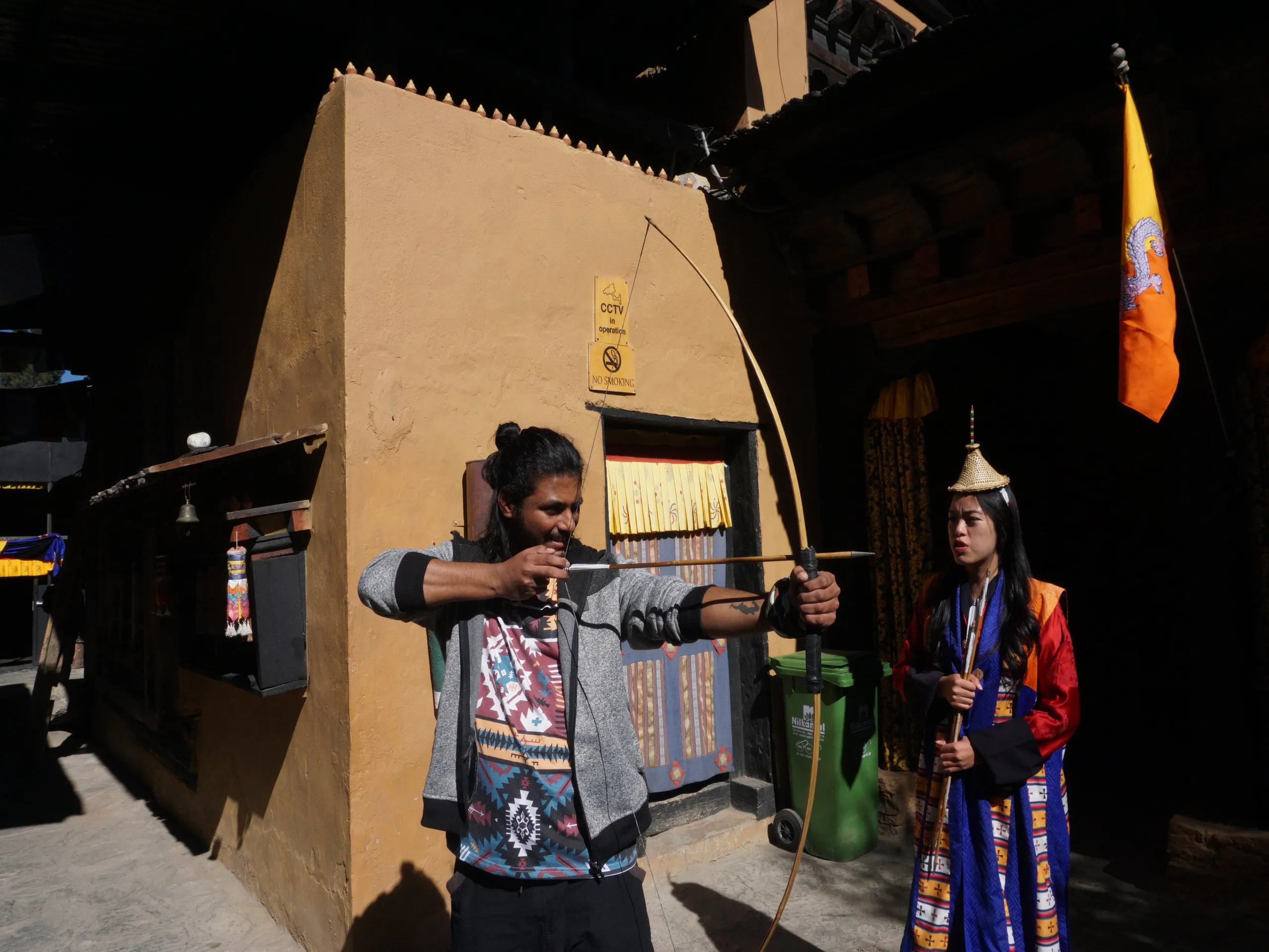 Friend trying archery at Simply Bhutan Museum